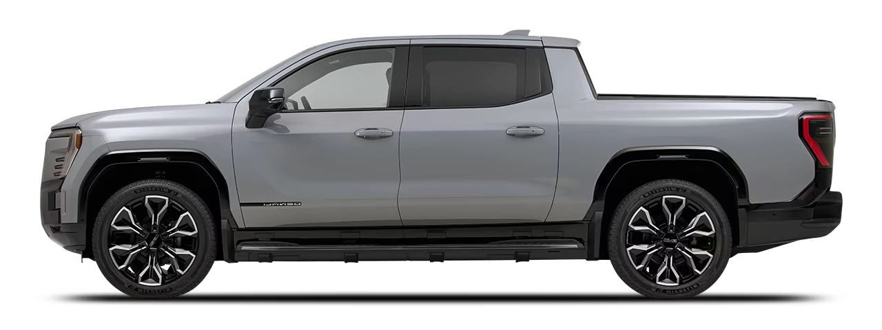 GMC Sierra EV z profilu - elektryczny pickup z baterią Max Range 205 kWh, jednofazowym ładowaniem AC 19,2 kW przez Type 1 i ładowaniem DC 350 kW przez CCS1